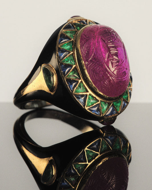 ART DECO EGYPTIAN REVIVAL RING WITH A CARVED BURMESE RUBY